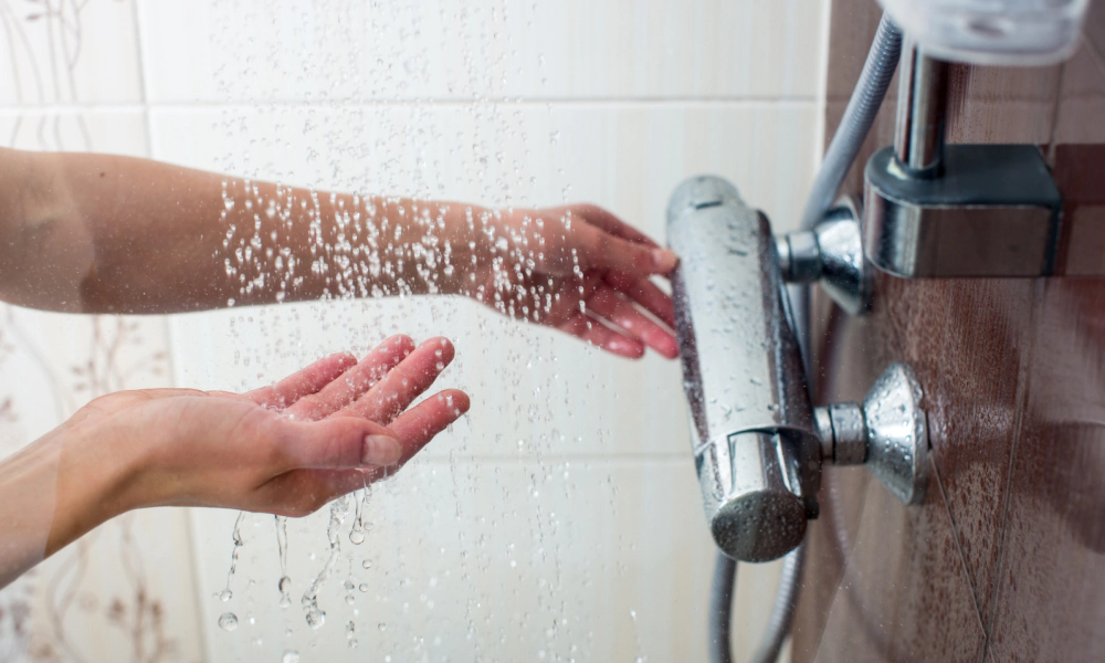 hands of woman taking shower